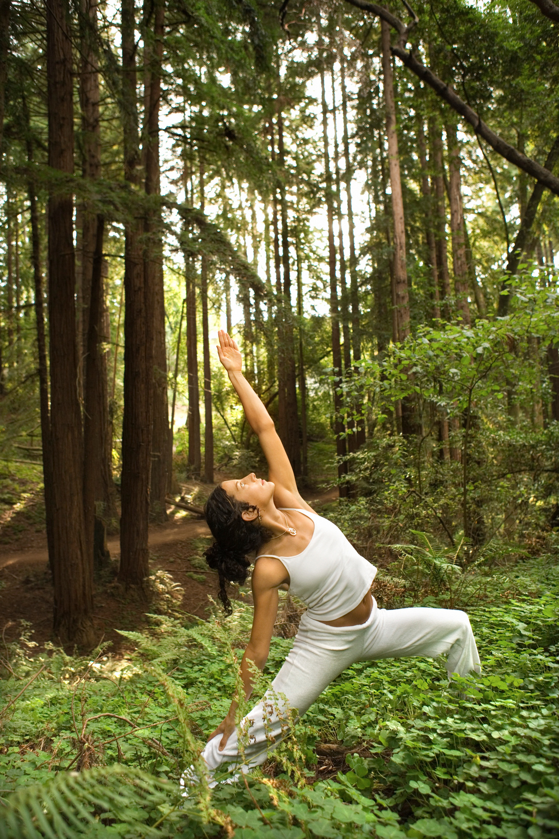 Woman doing yoga in forest